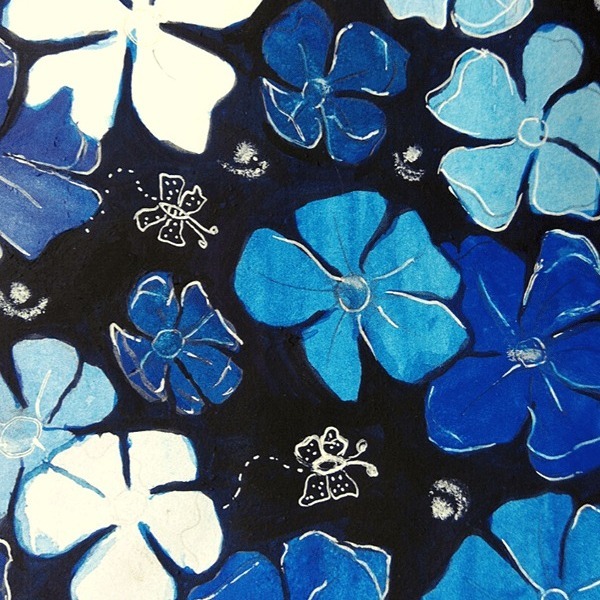Watercolor painting of blue floral patterns on a dark background