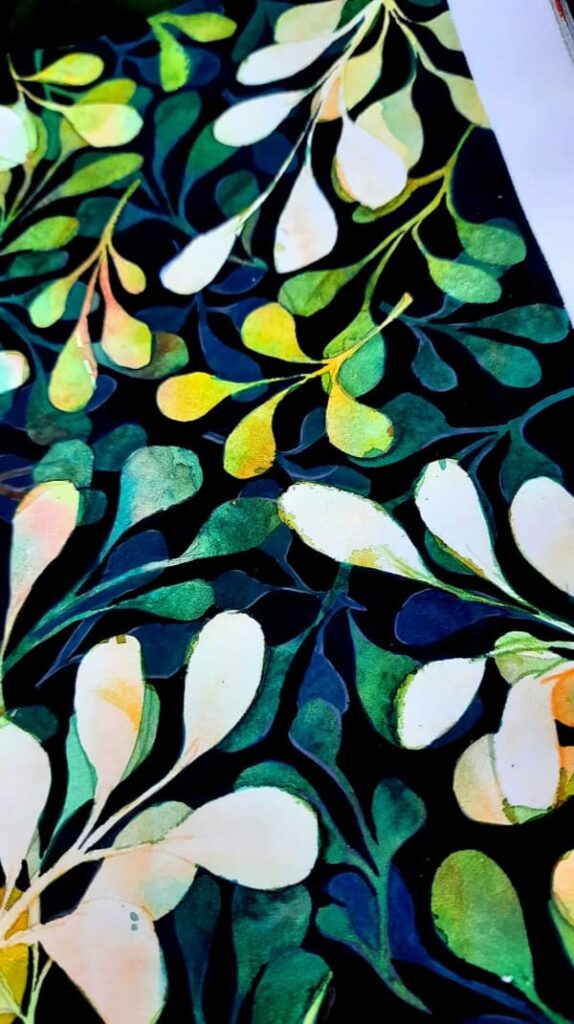 watercolor artwork with green leaf-like patterns