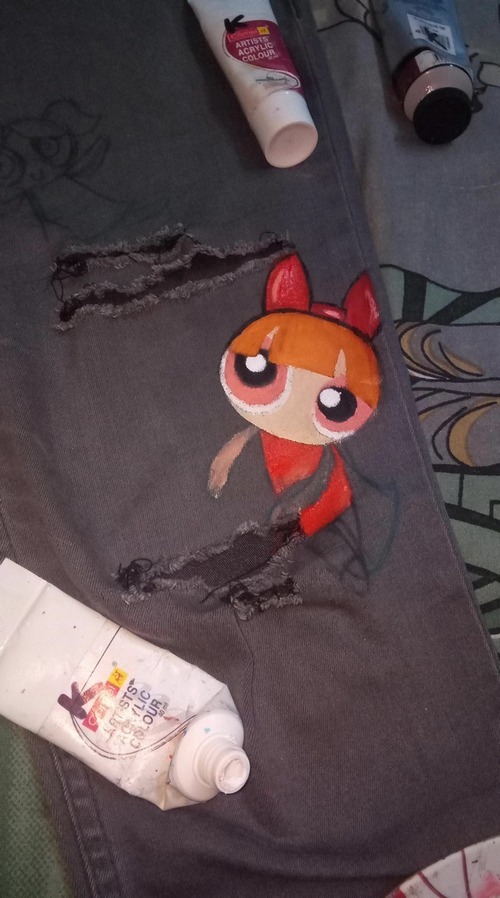 Black hoodie sleeve featuring hand-painted Powerpuff Girls character artwork