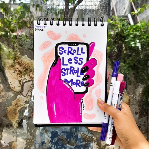 Pink scroll-themed typography artwork photographed outdoors