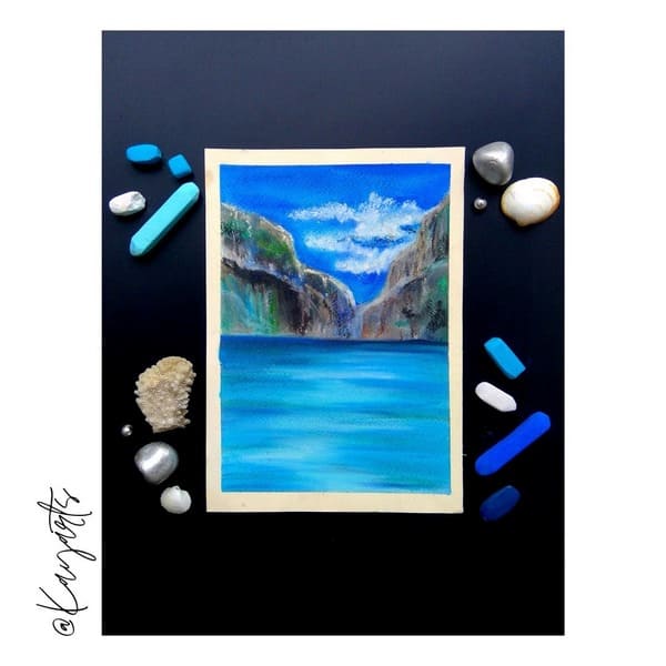 Soft pastel painting of a mountain waterfall surrounded by blue water and stones